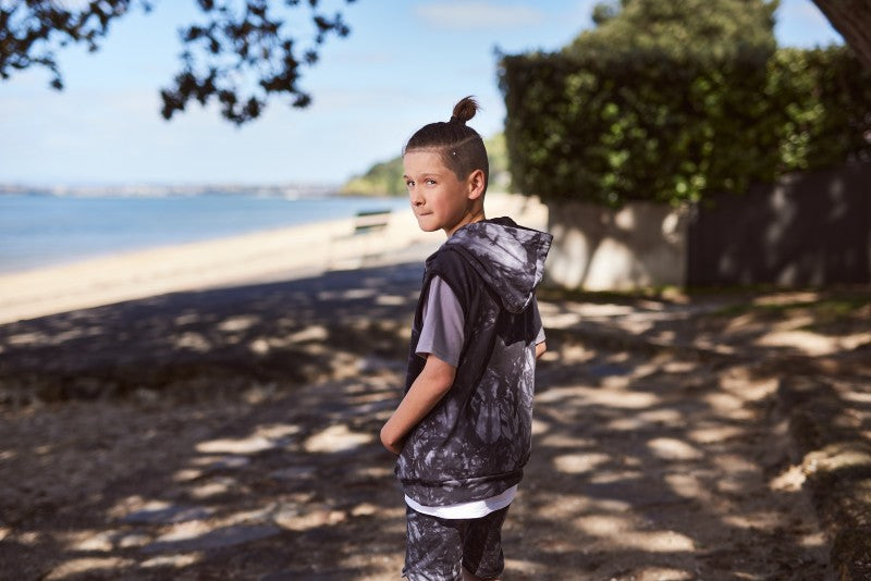 Cotton / spandex terry sleeveless hood in black tie-dye. Radicool Dude badge on chest & bolt print in white on reverse shoulder. A great piece for layering on cooler days or throw on as is. Fit is true to size.