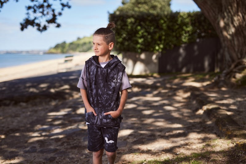 Cotton / spandex terry sleeveless hood in black tie-dye. Radicool Dude badge on chest & bolt print in white on reverse shoulder. A great piece for layering on cooler days or throw on as is. Fit is true to size.