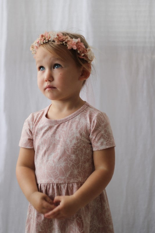 Our Cap Sleeve dress is everything you would hope for (and more) in an easy wear summer dress for your little Lady.  Featuring the cap sleeve for extra sun coverage and cuteness, its made from our organic cotton (95%) and elastane (5%) so its nice and cool with a little bit of stretch.  Our new Botanichaos design is chaotic yet subtle in white on this dress with the dusty rose fabric base. Available in size 1 right up to size 6.
